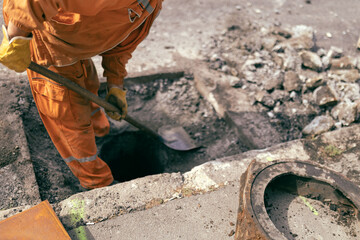 Construction worker working on a public city road reconstruction