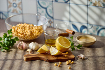 Chickpeas, lemon, tahini and herbs, ingredients for making hummus