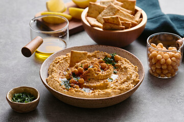 Delicious hummus with olive oil, chickpeas and parsley
