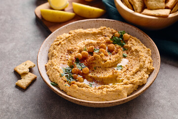 Delicious hummus with olive oil, chickpeas and parsley