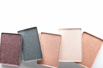 Beautiful eye shadow refill pans on white background, flat lay. Space for text