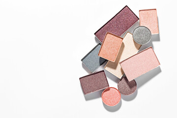 Beautiful eyeshadow refill pans on white background, flat lay. Space for text