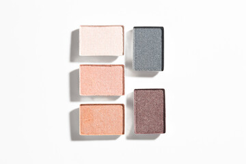 Beautiful eyeshadow refill pans on white background, flat lay