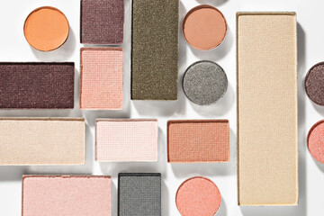 Beautiful eyeshadow refill pans on white background, flat lay