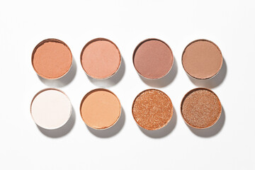 Beautiful eyeshadow refill pans on white background, flat lay