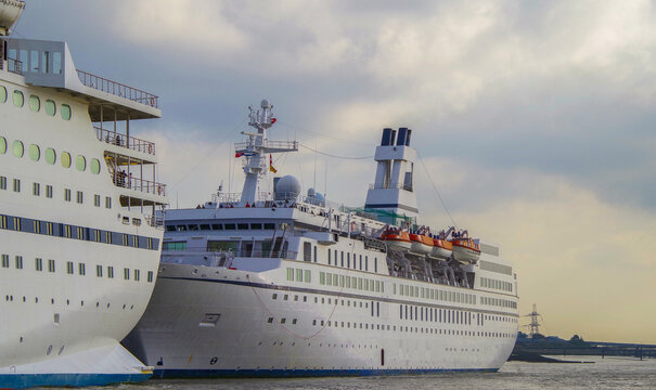 Classic small cruiseship cruise ship liner Astor docked at terminal in Tilbury, London on River Thames on sunny summer day during North Sea cruising