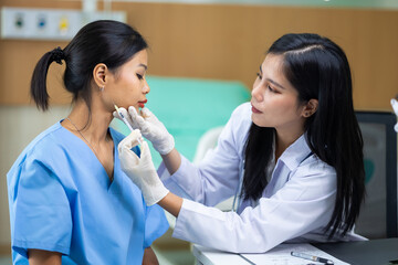Facial aesthetics surgery treatment : Plastic (Cosmetic) Surgery Center : Asian female Doctor...