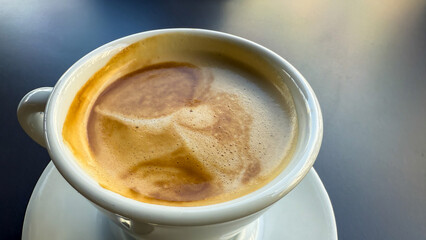 Velvety crema crowns the steaming espresso, evoking warm conversations on International Coffee Day, with hints of caffeine alchemy