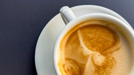 Steaming cappuccino with frothy whimsy, evoking cozy autumn mornings, International Coffee Day celebrated with artistic crema patterns