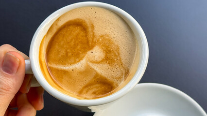 Sipping robust espresso with abstract latte art, Secret Santa reflection, hygge mood, freshly brewed awakening, Morning Brewfest celebration