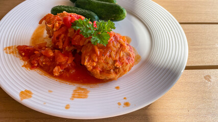 Hearty cabbage rolls lounging in vibrant tomato sauce, perfect for Slavic Maslenitsa or Oktoberfest's culinary delight celebrations