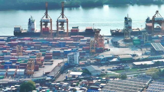 Explore bustling Bangkok Port with vibrant container activity in serene waters