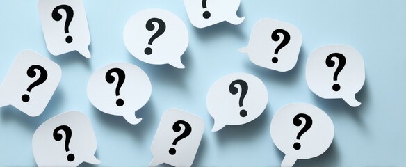 The collection of question mark speech bubbles on a light blue background.