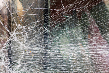 This is a close up view featuring a broken glass window