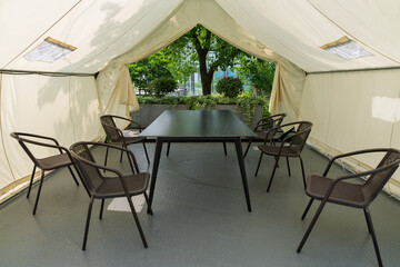 Camping tent in the urban oasis