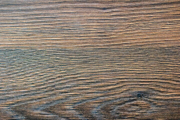A detailed closeup of a wooden surface with a striking striped pattern