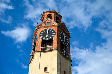 Clock on the tower. The big clock on the building shows the exact time.