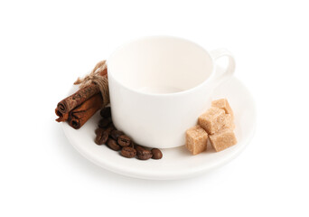 Ceramic cup with roasted coffee beans, sugar and cinnamon isolated on white
