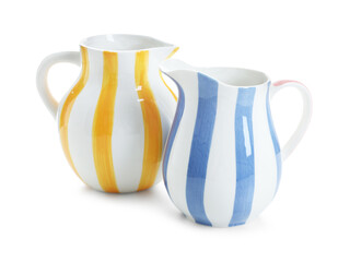 Fototapeta na wymiar Two striped ceramic jugs isolated on white