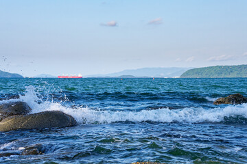 seascape with an industrial ship in the background, sea of genkai, kyushu, japan