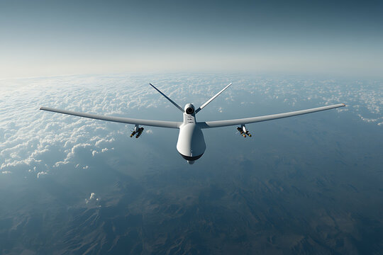 Unmanned aerial vehicle flying high in the sky over land and clouds. Remote controlled, aerial observation, surveillance drone, reconnaissance drone.