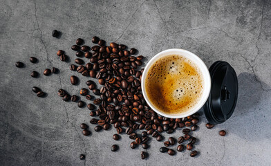 Coffee crema espresso in paper Coffee cup and bean on gray background, Top view of Espresso in  Takeaway paper coffee cup.