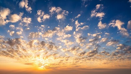 Obraz premium heavenly sky with white clouds at light orange dawn sunrise wallpaper