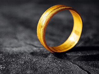 gold ring, gold price, gold jewelry, close up of gold ring on grey background