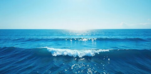Vast expanse of deep blue ocean water, waves gently rolling under a clear sky, sunlight reflecting on the surface Perfect for travel, nature, or environmental themes , water, texture, ocean