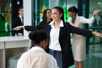 airport Security check: Woman officer using metal weapon scanner detector passenger at airport gate.