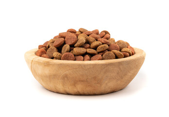 Dry pet food, dog color kibble pile, puppy meat and vegetable pellets, canine protein granules