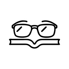 Glasses resting on an open book representing knowledge and learning  