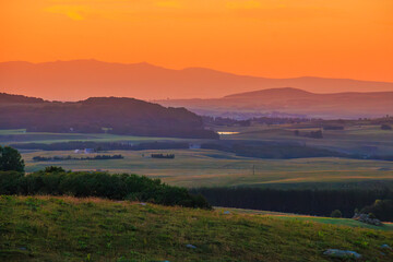 Evening landscape on the Aubrac mountains.
Field and hills on a beautiful spring evening in central...