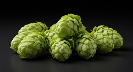 Obraz premium Green Hop Cone Pile Against Dark Background
