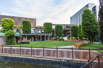 Contemporary Urban Park with Manicured Green Spaces and Modern Business Architecture