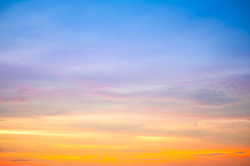Sky,Beautiful sunset view, luxury soft gradient orange gold clouds and sunlight on the blue dramatic sky perfect for the background, morning, evening,Twilight, climate change,horizontal sunset photo