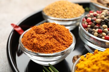 Different aromatic spices on light grey table, closeup