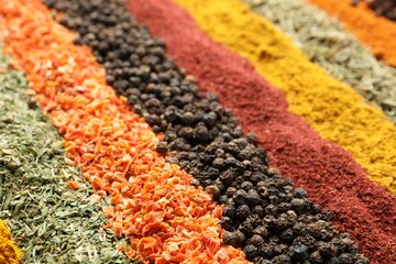 Many different spices as background, closeup view