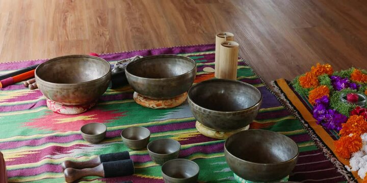 Tebet singing bowls stand on the floor before the start of the bowls ceremony