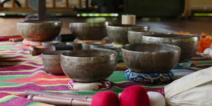 Tebet singing bowls stand on the floor before the start of the bowls ceremony