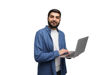 Confident individual working on a laptop in a bright, minimalistic studio setting