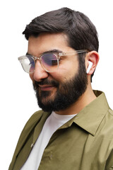 Stylish man enjoys music with wireless earbuds while wearing trendy glasses and a casual outfit