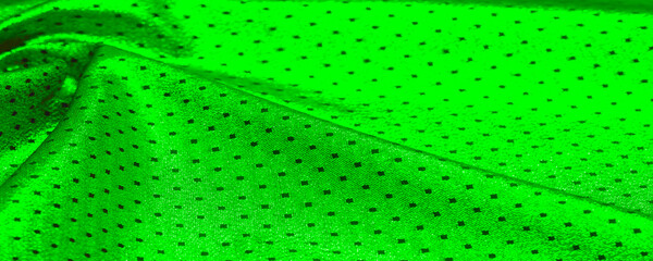 Fabric with a metallic sheen in small polka dots. Green color Be the center of attention at your next event with a striking metallic fabric design that delivers an incredibly smooth and vibrant sheen © Aleks