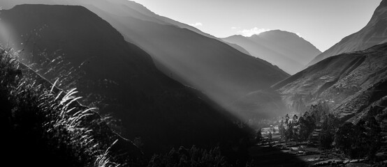 black and white panoramic view at sunrise dawn of chipuico village, charazani town north bolivia,...