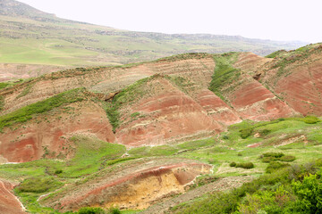 Colorful spectacular panoramic view of rainbow mountains hills in Georgia. Striped desert of...