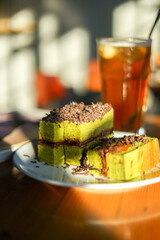 Matcha chocolate roll cake, Dessert made from green tea and chocolate blend with grated chocolate...