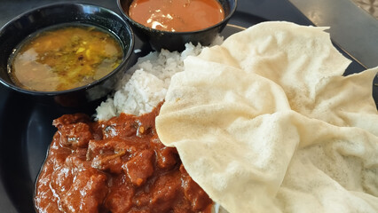 white rice with curry mutton and side dish