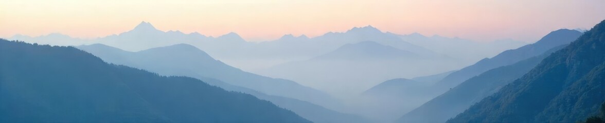 Fototapeta premium Misty mountain peaks shrouded in a smoky haze, creating an ethereal landscape Perfect for travel, nature, and atmospheric backgrounds , calm, valley