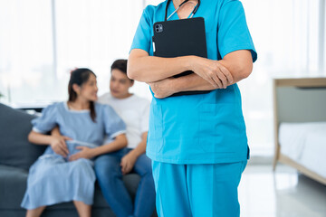 Obraz premium A caring gynecologist provides expert guidance and health care during a pregnancy examination. With ultrasound technology, the doctor offers advice to ensure the well-being of both and her family
