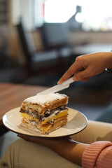 A delicious classic pastry cake, layered with chocolate cream and custard, ready to be enjoyed. Perfect for cafes, desserts or sweet moments